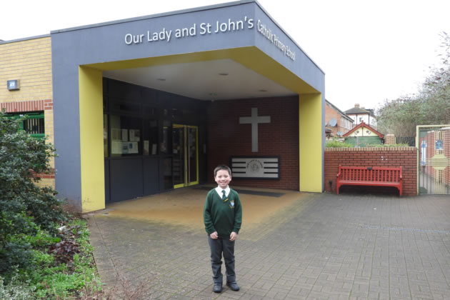 James ‘JC’ Connor outside his school in Brentford 